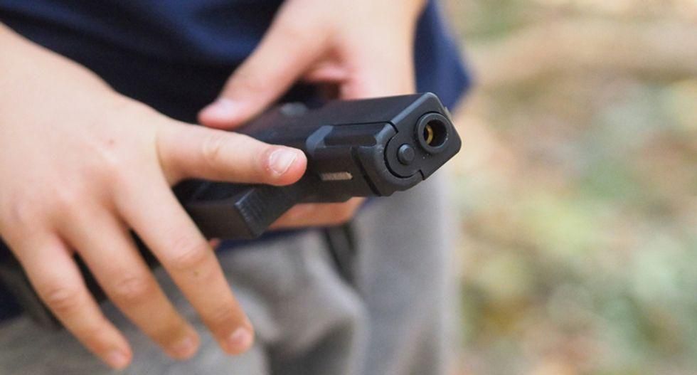 Watch: Man's gun discharges during confrontation with neighbor over 'racial issue' involving their children