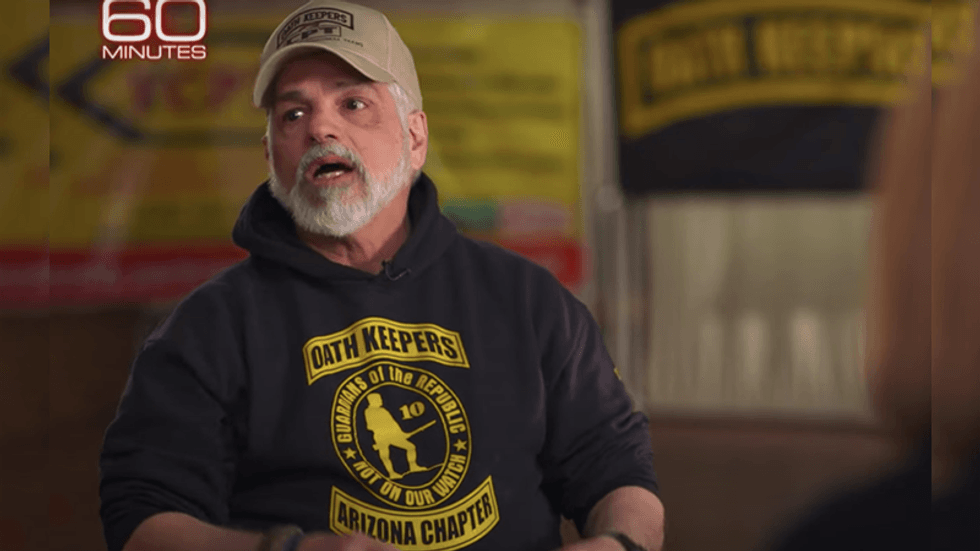 A charismatic interloper preached readiness and race war to the Oath Keepers. Was he a federal agent or just a 'messed-up vet'?
