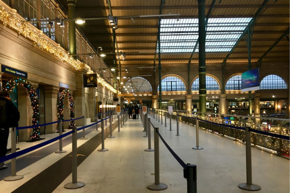 A festive but sparsely populated Eurostar check-in area at Paris's Gare du Nord as a mass strike begins across France over pension reforms on December 5, 2019.