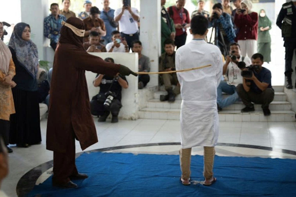 Two men publicly flogged in Indonesia for gay sex