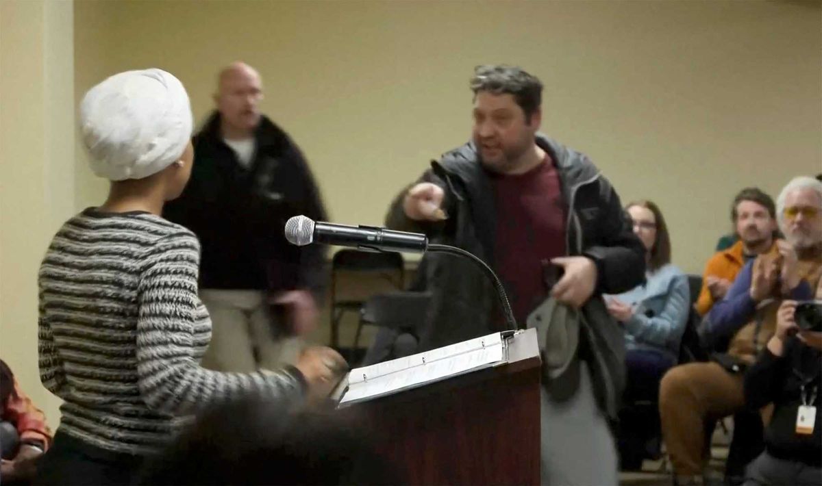 Man charges Ilhan Omar at podium and sprays her with mystery substance during town hall