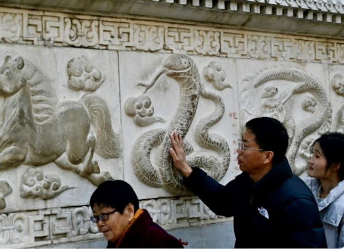Prayer and dance: hundreds of millions in Asia celebrate Year of the Snake