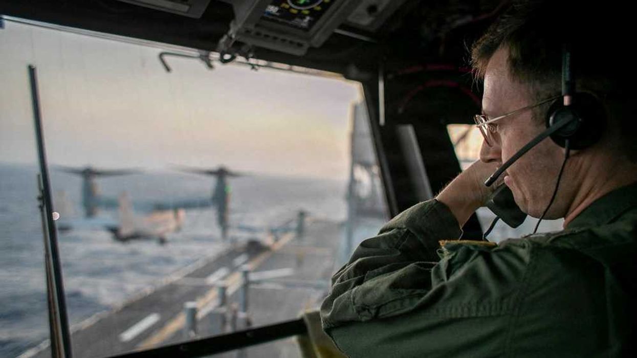 Navy searching for missing crew member after emergency landing