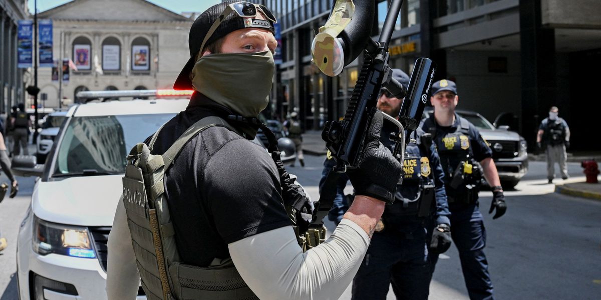 'Bang, bang you're dead, liberal': Video shows federal agent pointing gun at protester