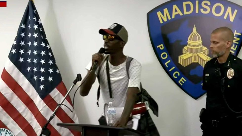 'Give me this microphone!' Chaos as protesters take over police chief's press conference