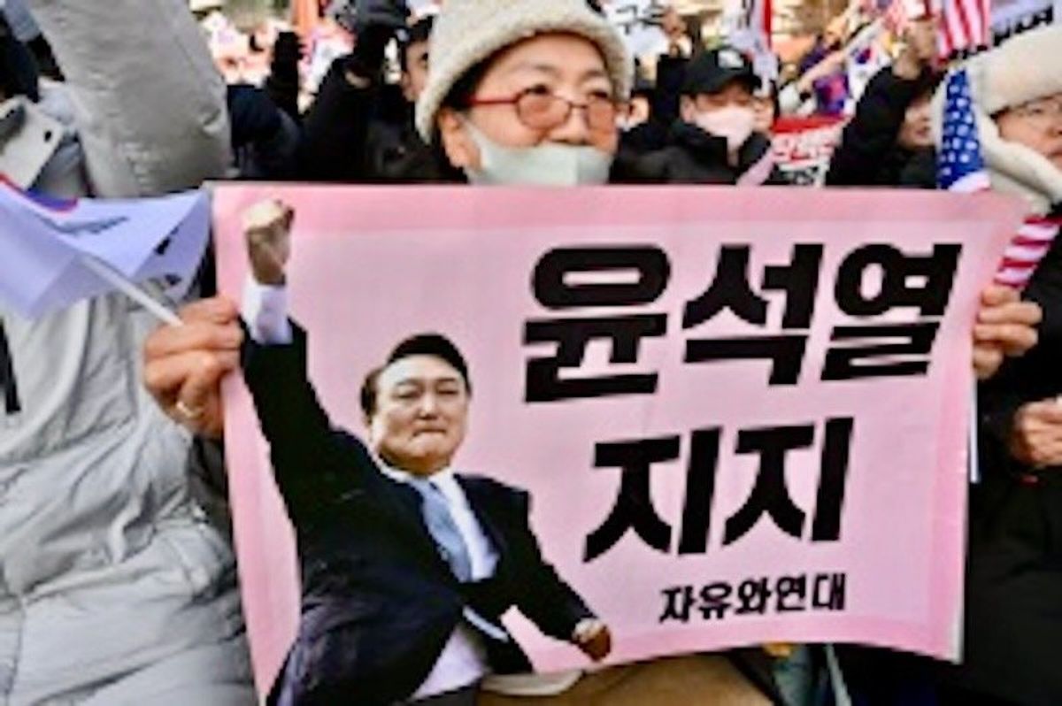 South Korea's impeached president resists arrest over martial law bid
