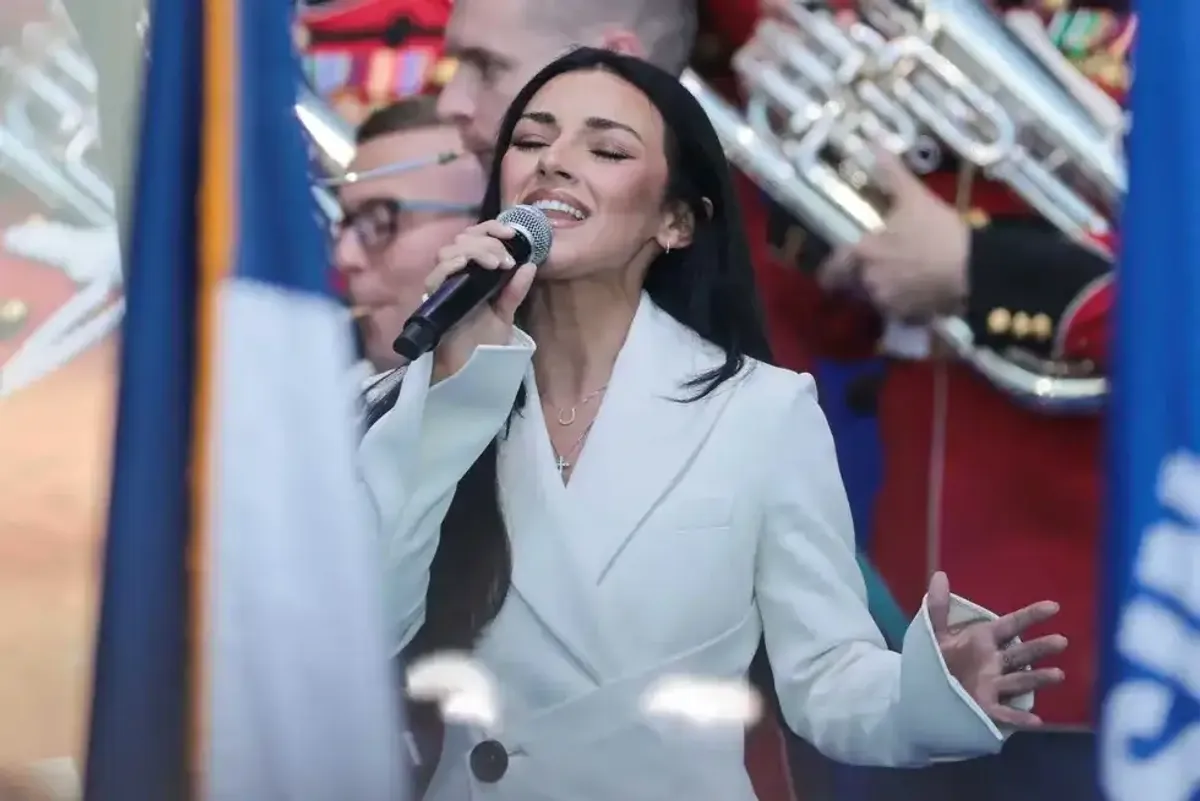 Kash Patel's girlfriend mercilessly mocked for 'murdering' National Anthem at Trump's fair