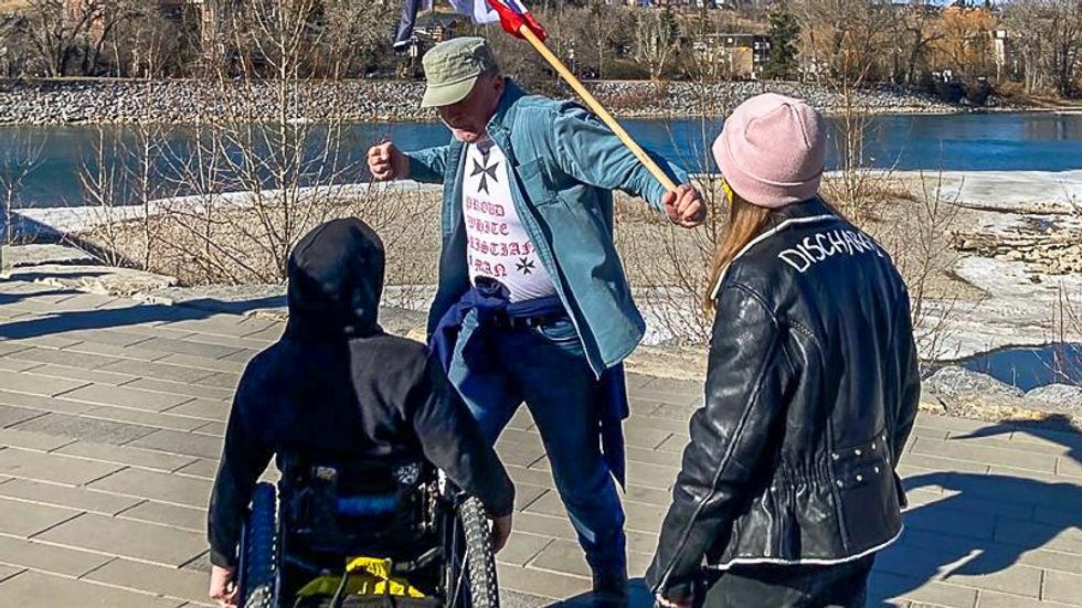 'Nazi' punches wheelchair-bound man and assaults wife with flagpole at 'freedom rally': report