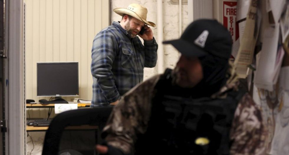 Ammon Bundy talks on the phone in an office at the Malheur National Wildlife Refuge near Burns, Oregon, January 5, 2016. (REUTERS/Jim Urquhart)