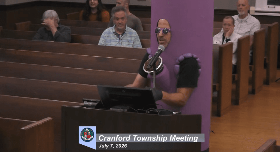 Chaos as singing protesters take over town council meeting in blue district