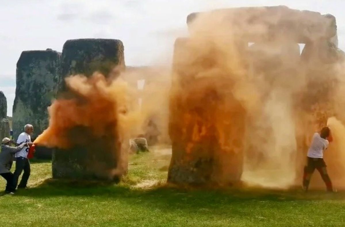 UK police arrest pair after Stonehenge sprayed with orange substance