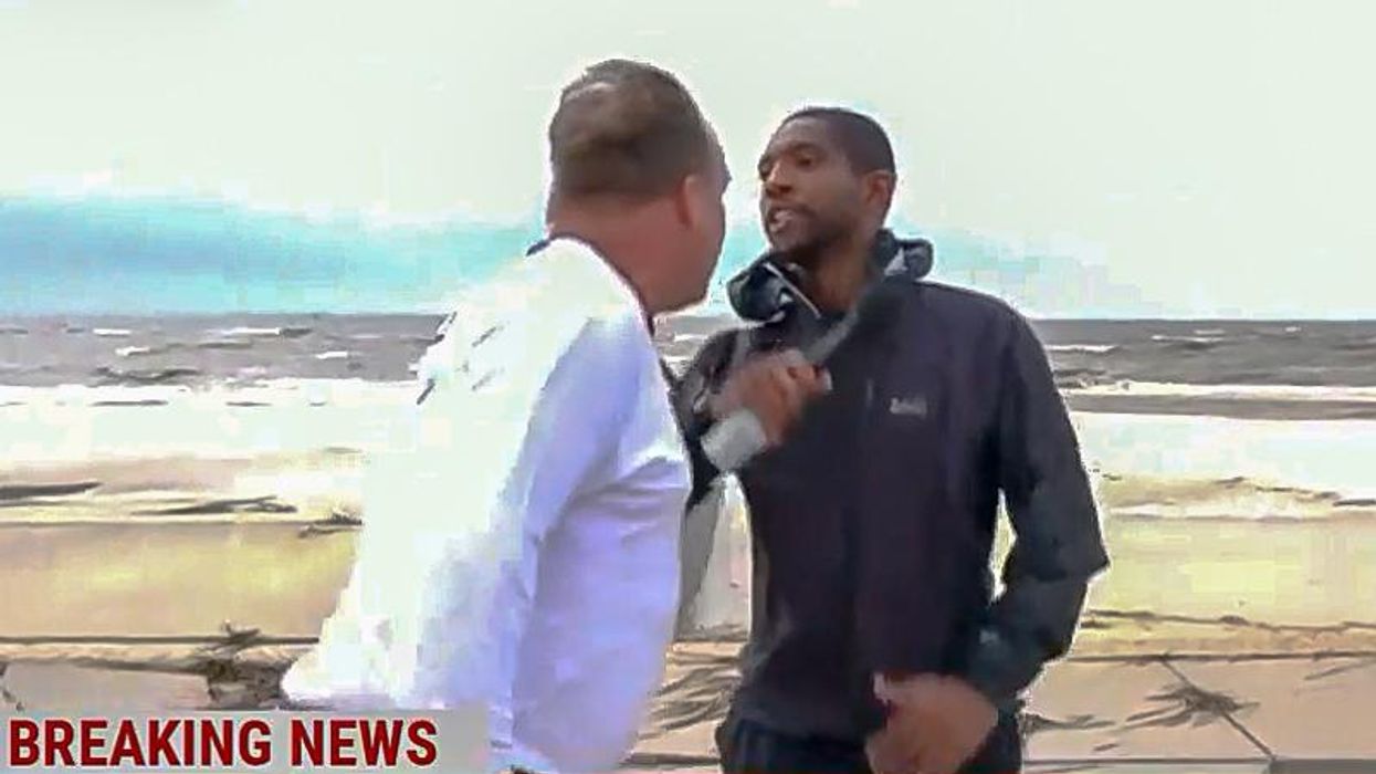 WATCH: Angry white man lunges at NBC correspondent during live hurricane report