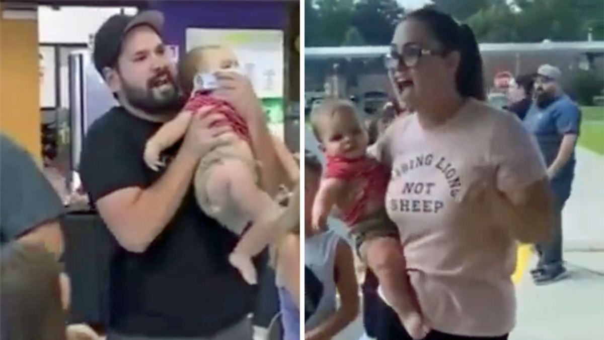 WATCH: Mask-hating parents use their own toddler as a political prop during angry rants