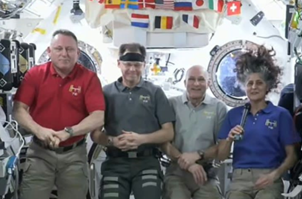 U.S. astronauts upbeat seven months into eight-day mission