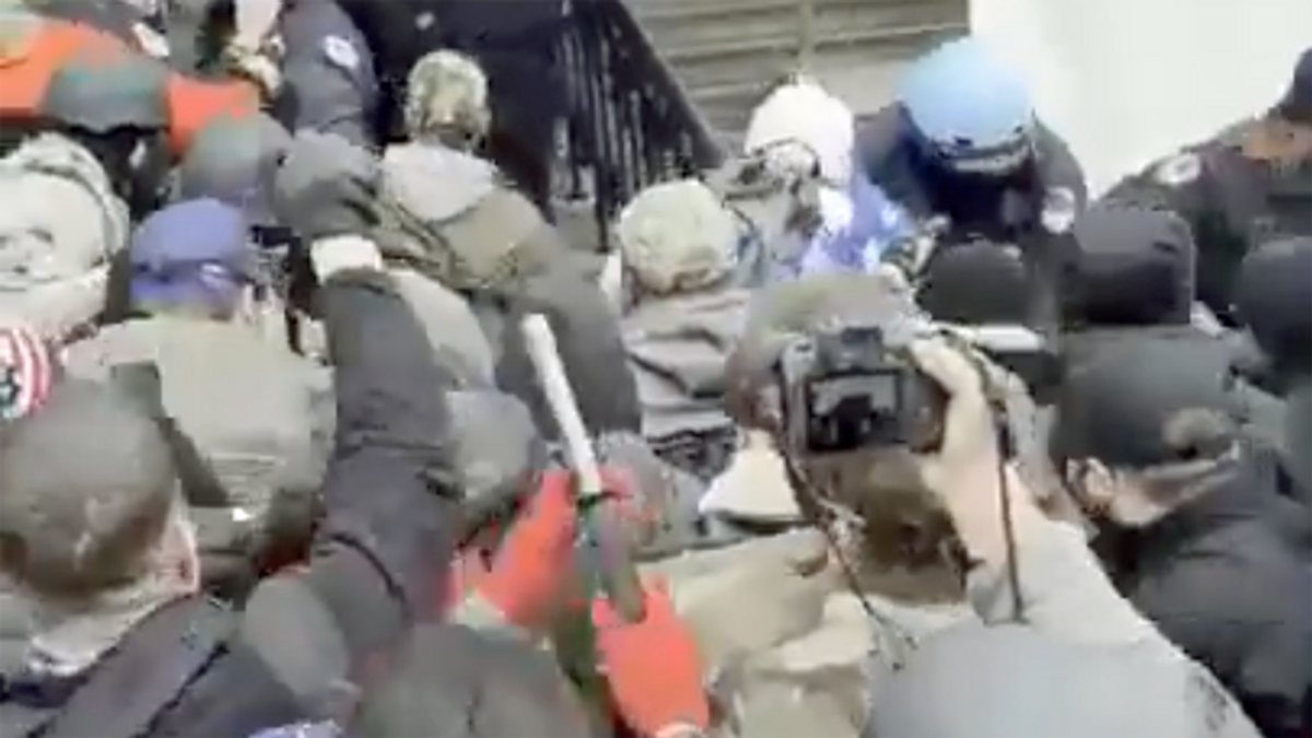 New insurrection video shows Proud Boys overrunning police