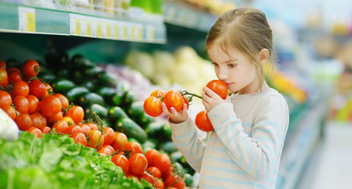 Child with tomatoes