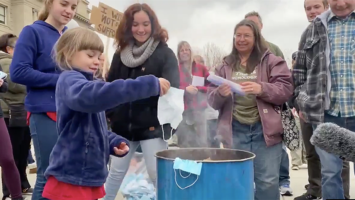 'Very close to child abuse': Doctor attacks protest where parents force children to burn masks