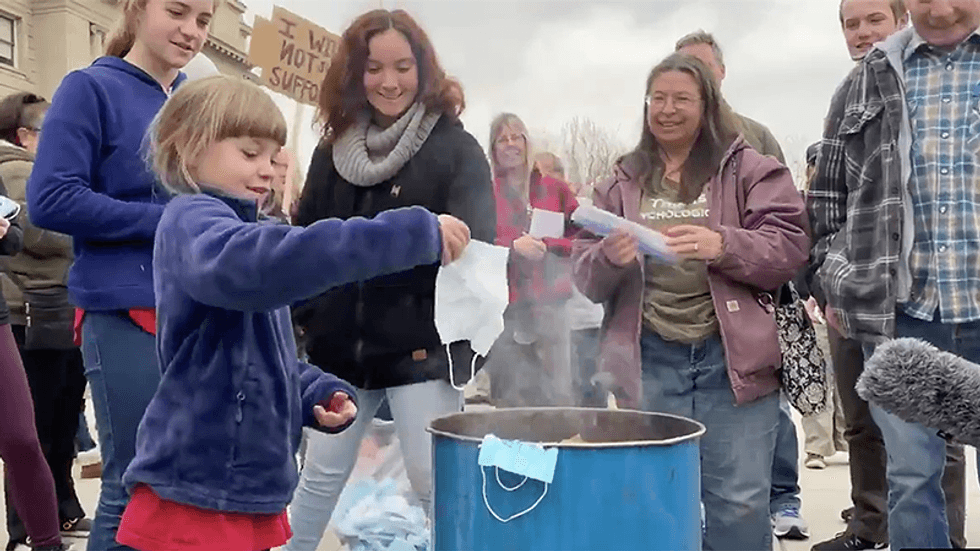 'Very close to child abuse': Doctor attacks protest where parents force children to burn masks