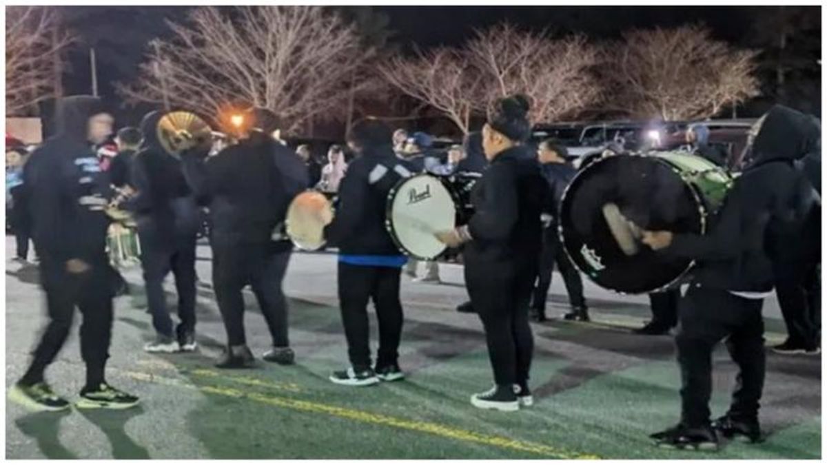 Man flashes shotgun at middle school band as they prepare for local parade