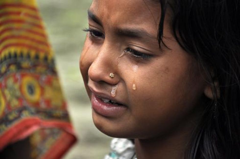 India appeals for calm after 32 Muslim women, children are shot to death in their sleep