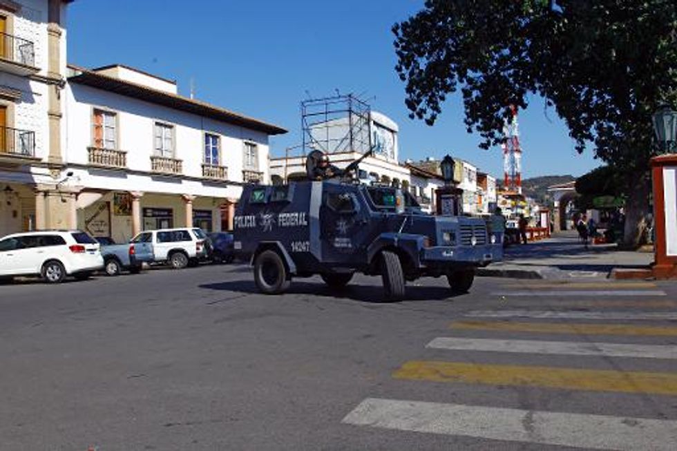 Vigilantes enter 'crown jewel' of Mexican drug cartel's key bastion in Apatzingan