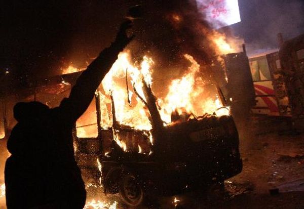 Protesters battle police, dozens wounded in bloody Ukraine clashes