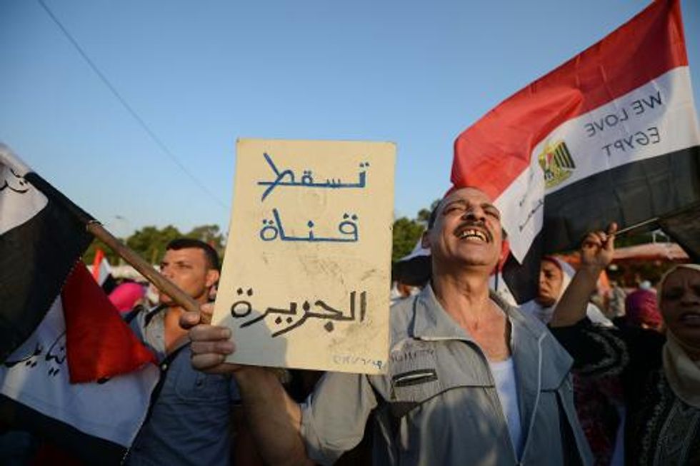 Egypt to put 20 Al-Jazeera journalists on trial for 'airing false news'