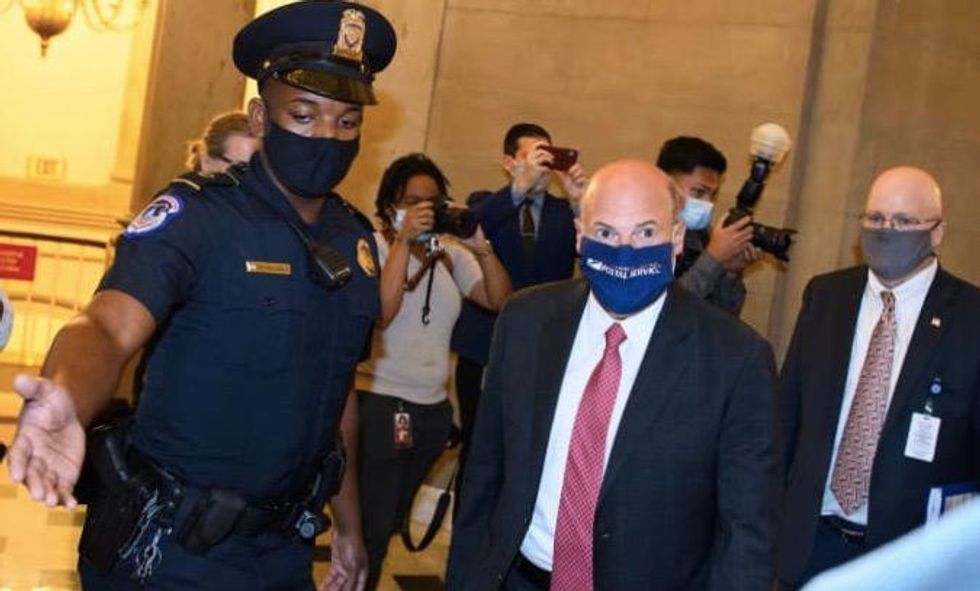 Biden urged to fire entire Postal Service board for complicity in 'devastating arson' by Trump and DeJoy