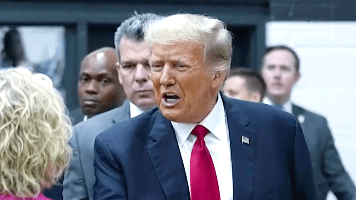 First Trump co-defendant surrenders at Fulton County jail