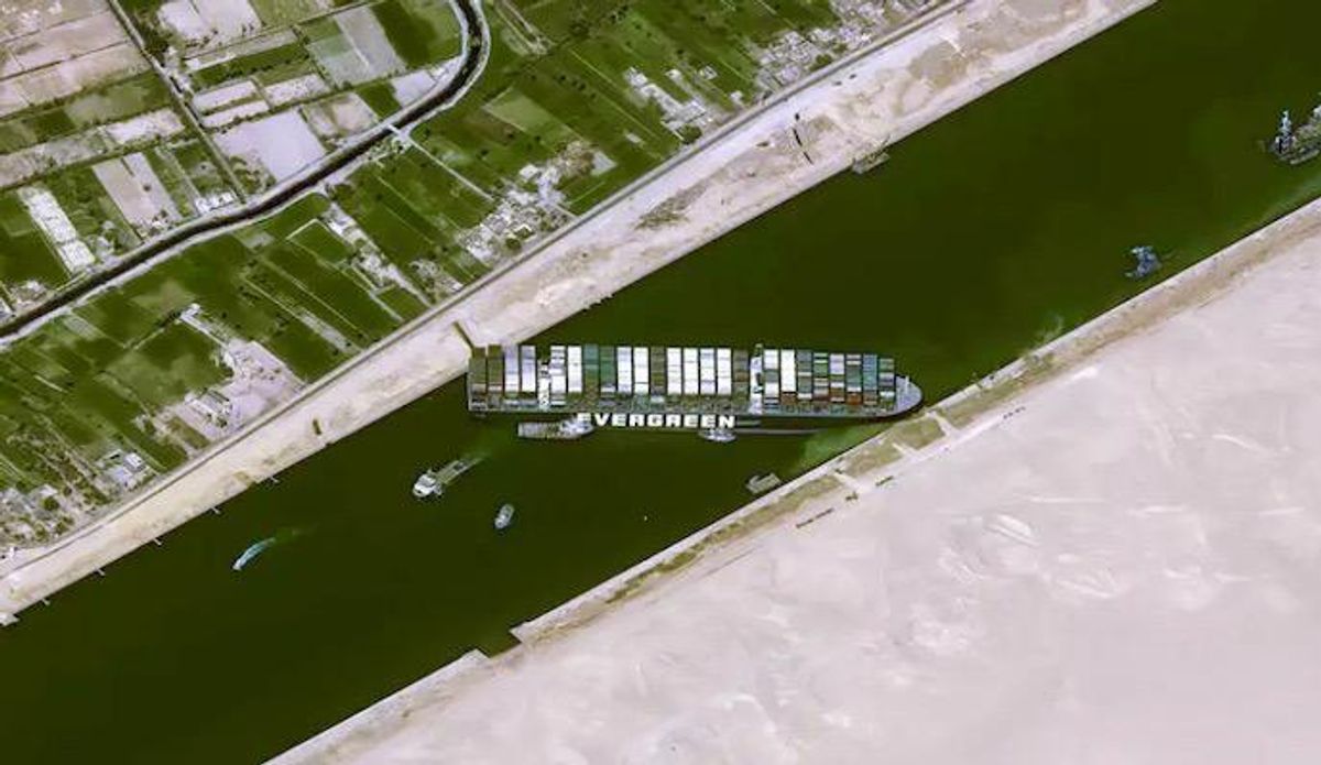Tugs and dredgers try to free megaship blocking Suez Canal
