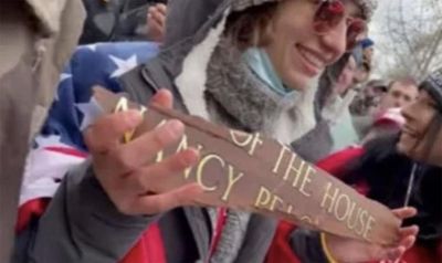 treasonous piece of shit carrying a stolen sign after attacking the seat of dempcracy, get fucked