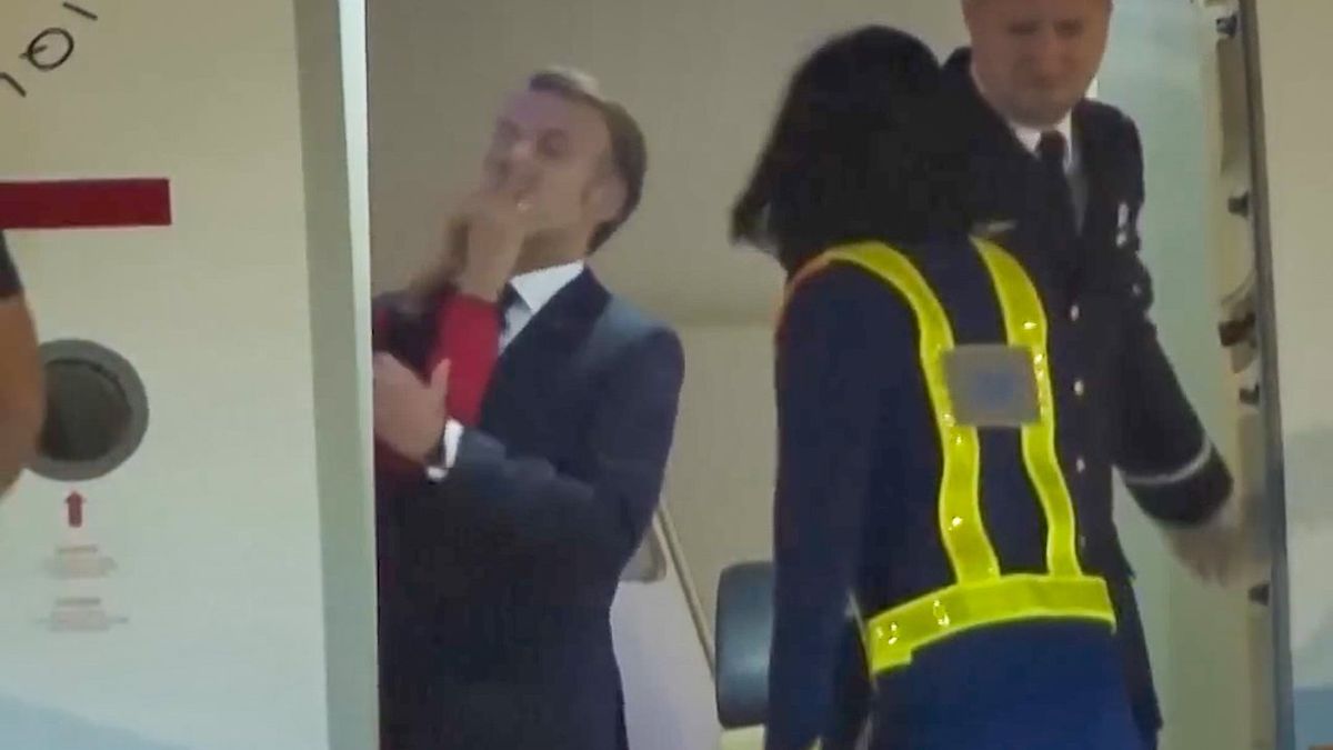 Watch: French President Emmanuel Macron appears to be shoved in face by wife