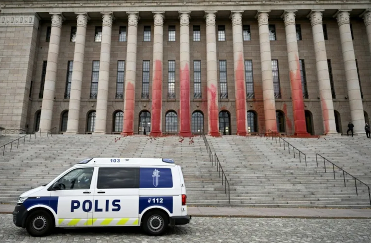 Environmentalists smear Finland's parliament in red paint