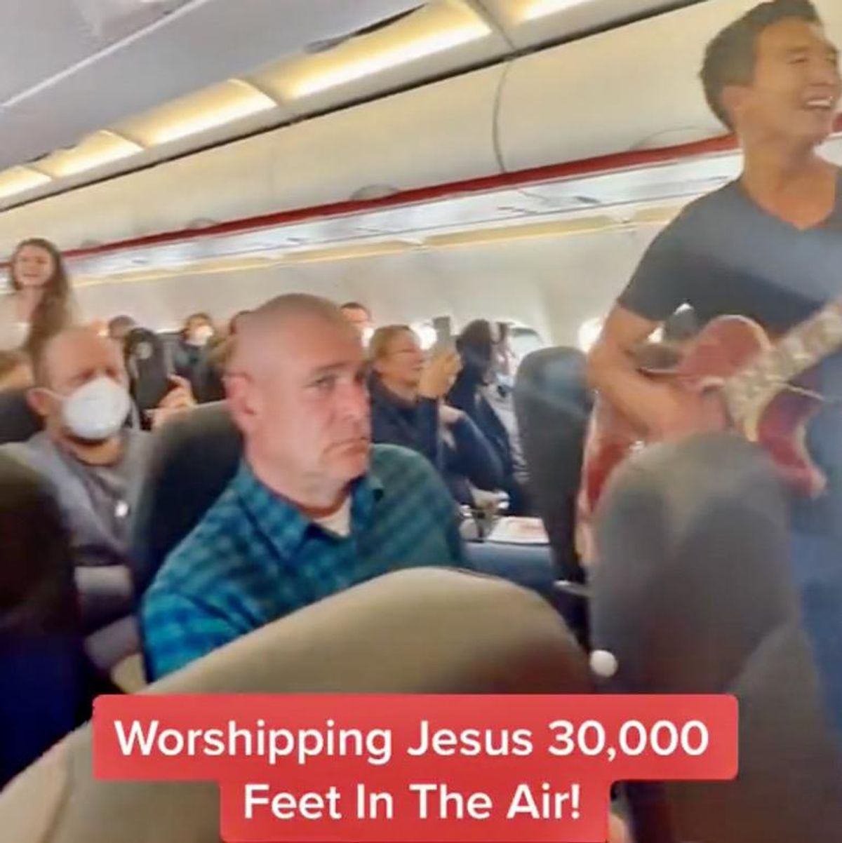 Evangelical Christians try to spread the gospel with on-board airplane cabin-wide preaching and singing (video)