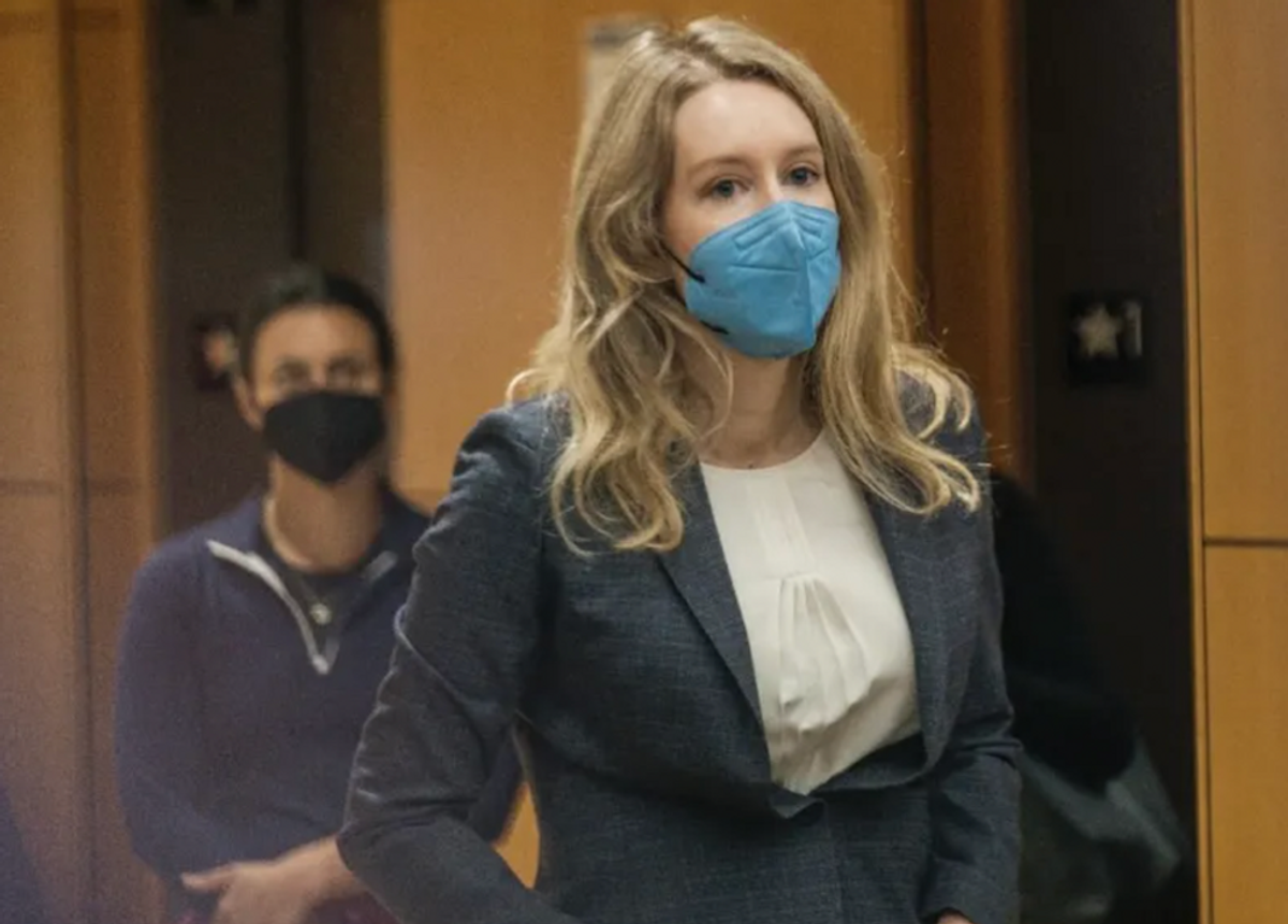 Theranos founder claims abuse by controlling boyfriend