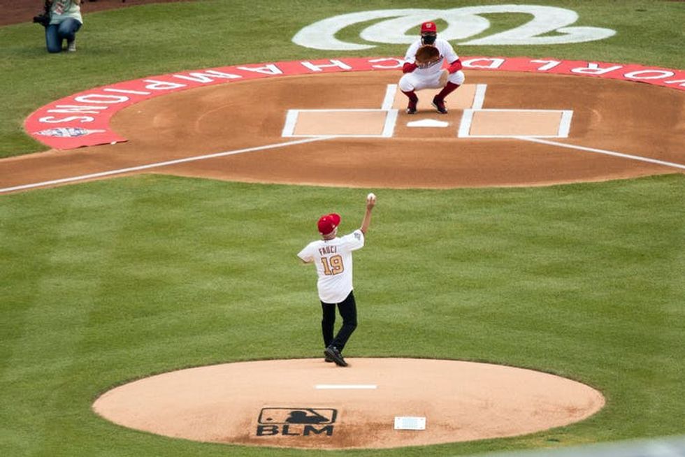 Fauci throws out a pitch at an MLB stadium