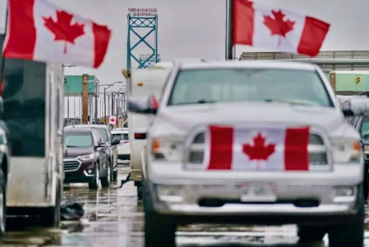 Canada truckers defy order to clear key bridge as protests swell