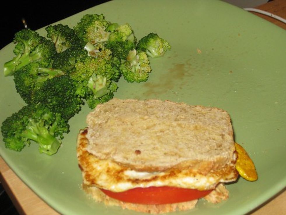 Fried egg sandwich and broccoli