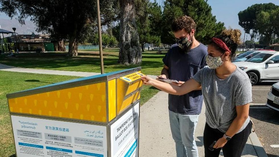 Voters seek injunction against right-wing vigilantes intimidating them at Arizona ballot drop boxes