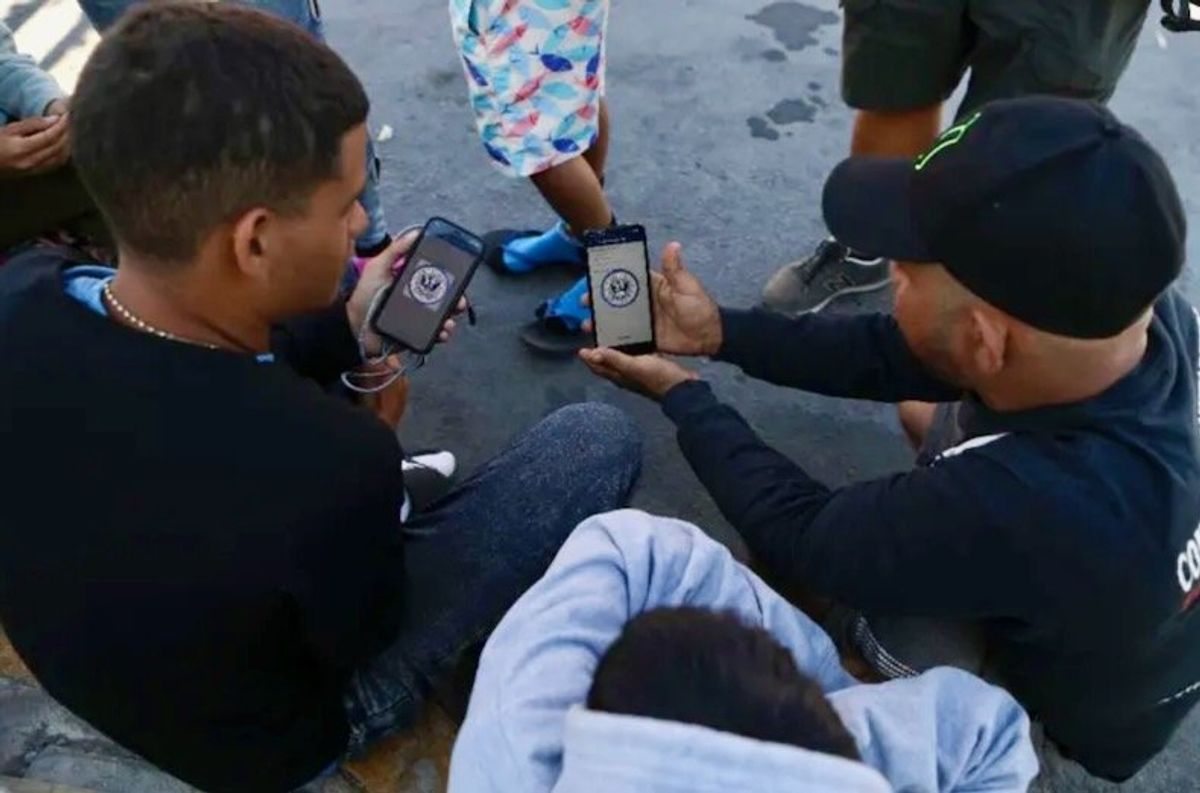 'A game of chance': Migrants battle glitchy app at U.S. border