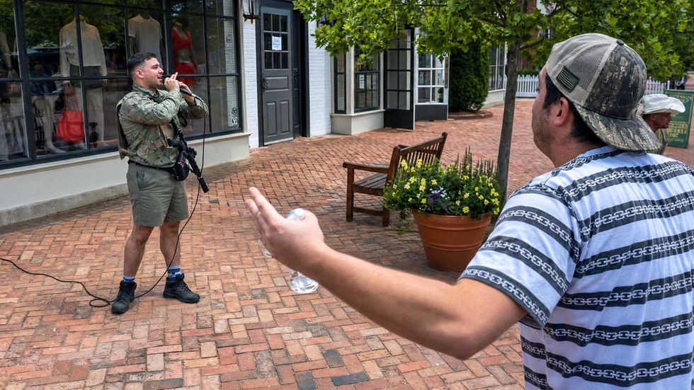 'You're a bad man!' Hecklers jeer armed J6 rioter during open carry rally in Virginia