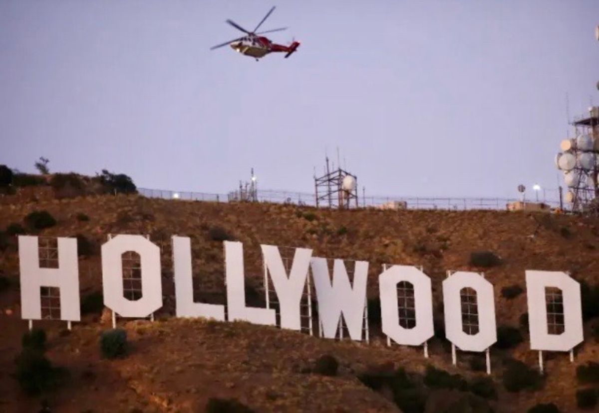 Six held after Tinseltown's famous sign changed to 'Hollyboob'