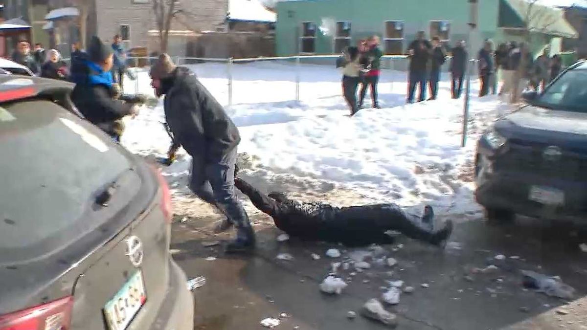 'She's pregnant!' ICE pelted with snowballs as agents hold woman 'face down on the ground'