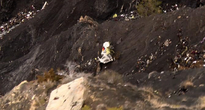 Germanwings pilot 'locked out of cockpit' before French Alps crash
