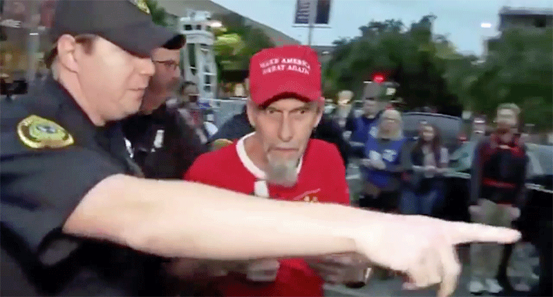 WATCH: Police respond to man in #MAGA hat involved in shoving match at Trump's Houston rally