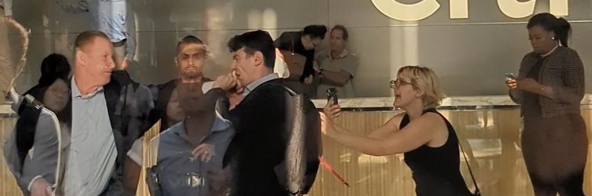 Watch: Citibank staffer punches climate activist during protest