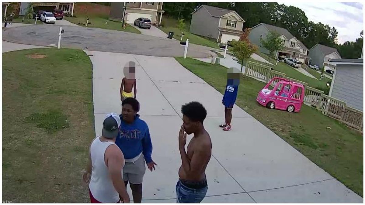 Enraged white man bolts out of his house and attacks Black teen with a belt for using profanity – and it's all caught on video