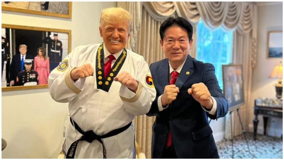 MMA fighter mocks Trump's participation trophy after he accepts honorary 9th-degree black belt at Mar-a-Lago