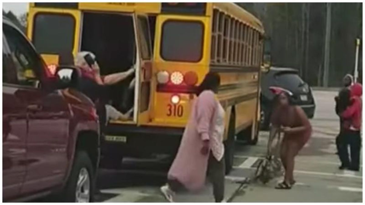 Shocking videos show children climbing out school bus windows after driver gets in altercation with parents