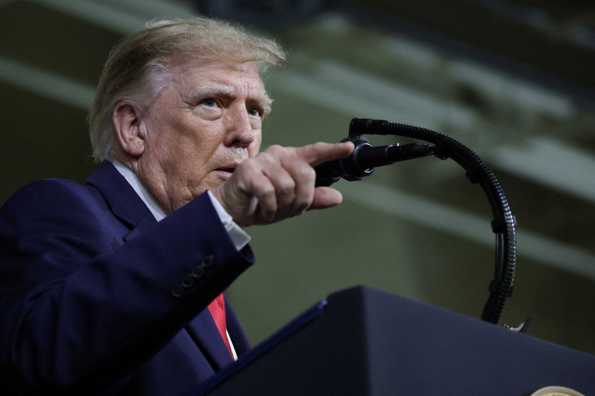 Trump singles out lone protester with baseless accusation: 'How much is she being paid?'